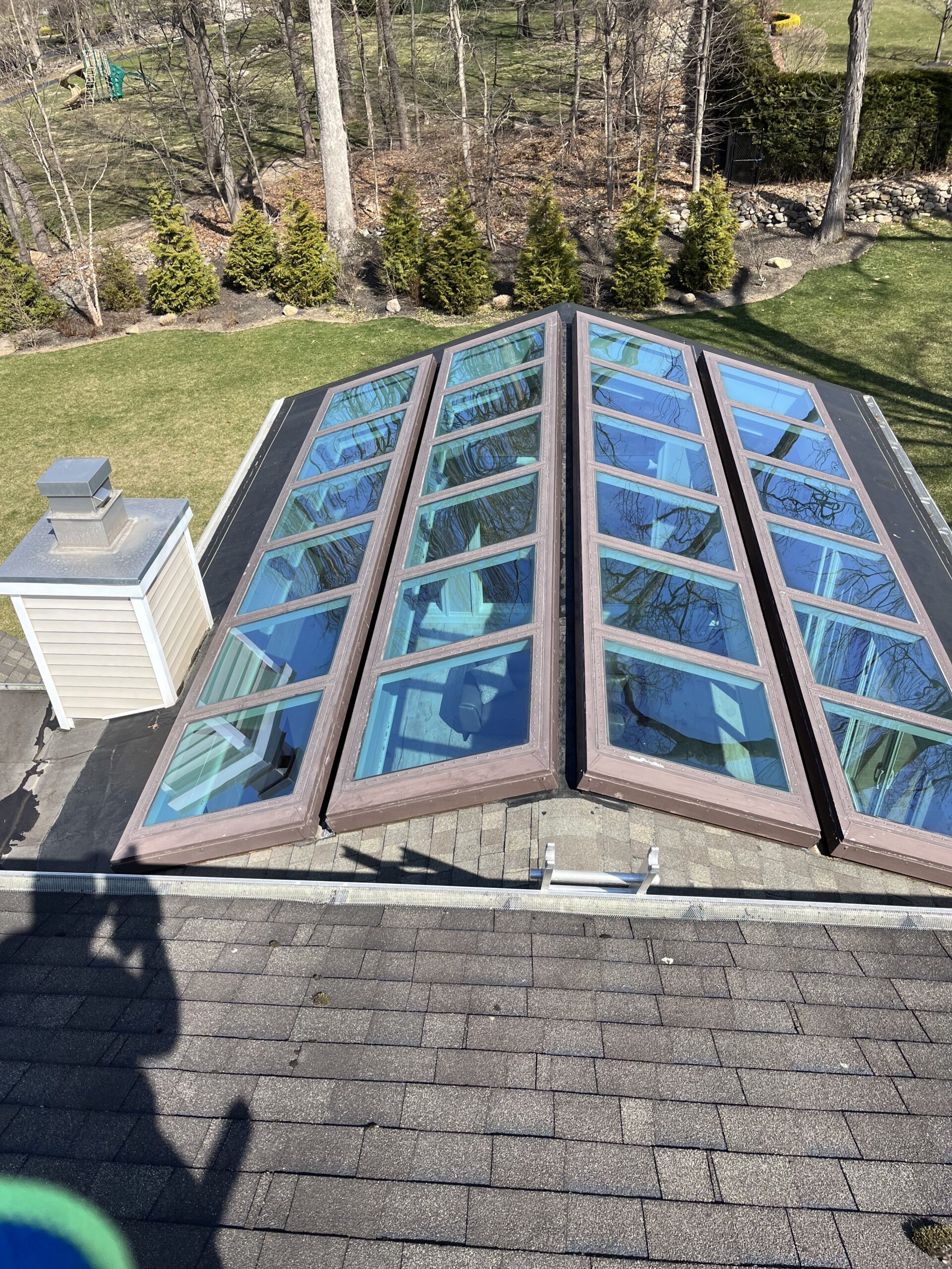 Brightness team cleaning a skylight window