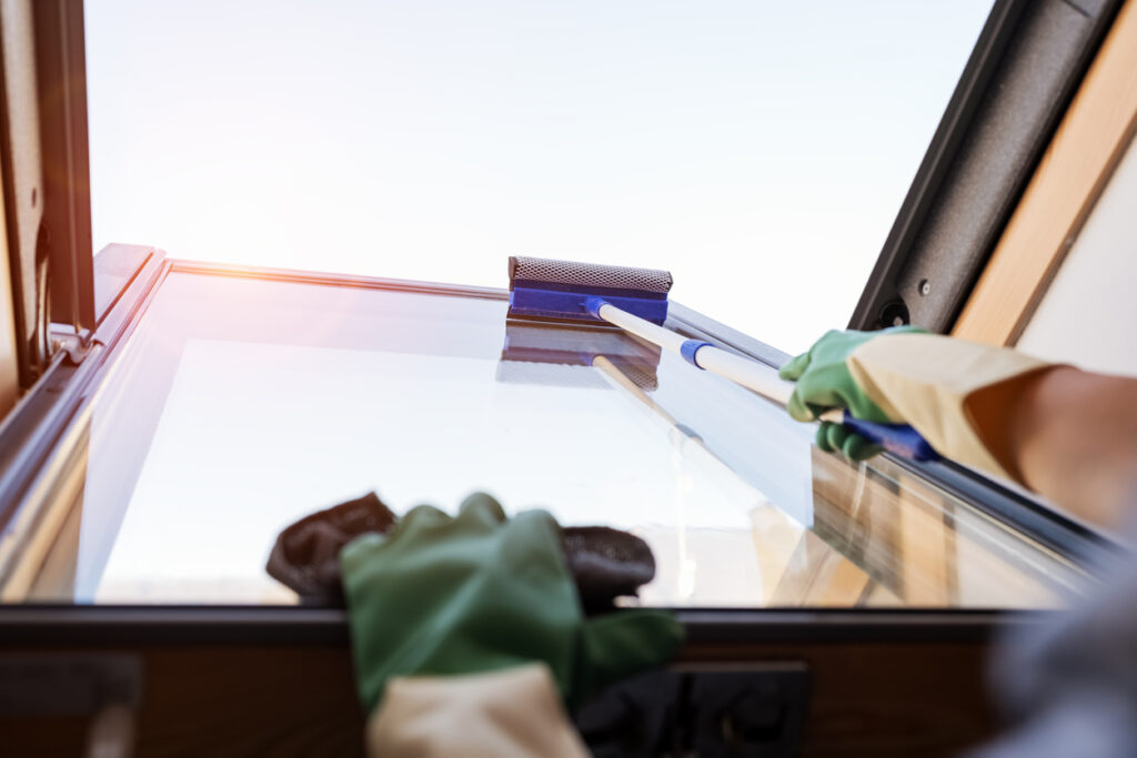 A brightness window cleaning team cleaning a skylight window