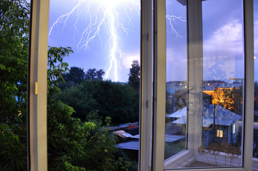 A storm approaching that can potentially damage or dirty up a window