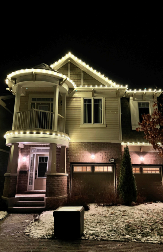A house with christmas lights decoration by Brightness window cleaning