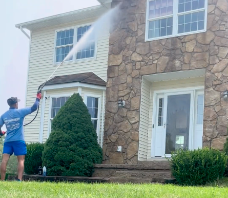 Softwashing a customers home before their christmas lights get installed.