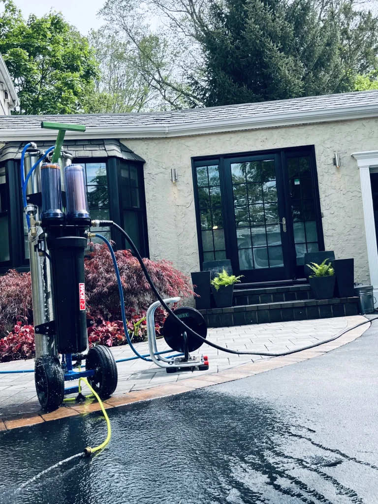 Brightness purified-water cart and hose ready for water-fed pole window cleaning with spot-free rinse water
